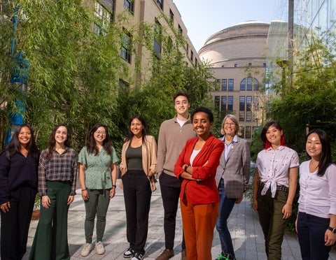 Jareet and a group of others standing in front of an MIT building.