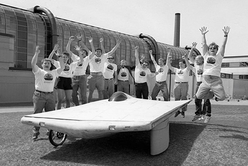 A group of students with the Midnight Sun.