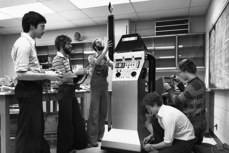 A group of engineering students working on an experiment.