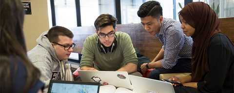 Students working on a laptop