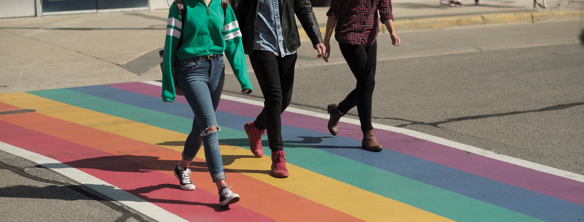 students walking across a rainbow crosswalk all - <alt tags> will be updated on pilots