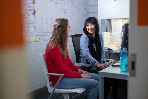 A student sitting down with an immigration consultant